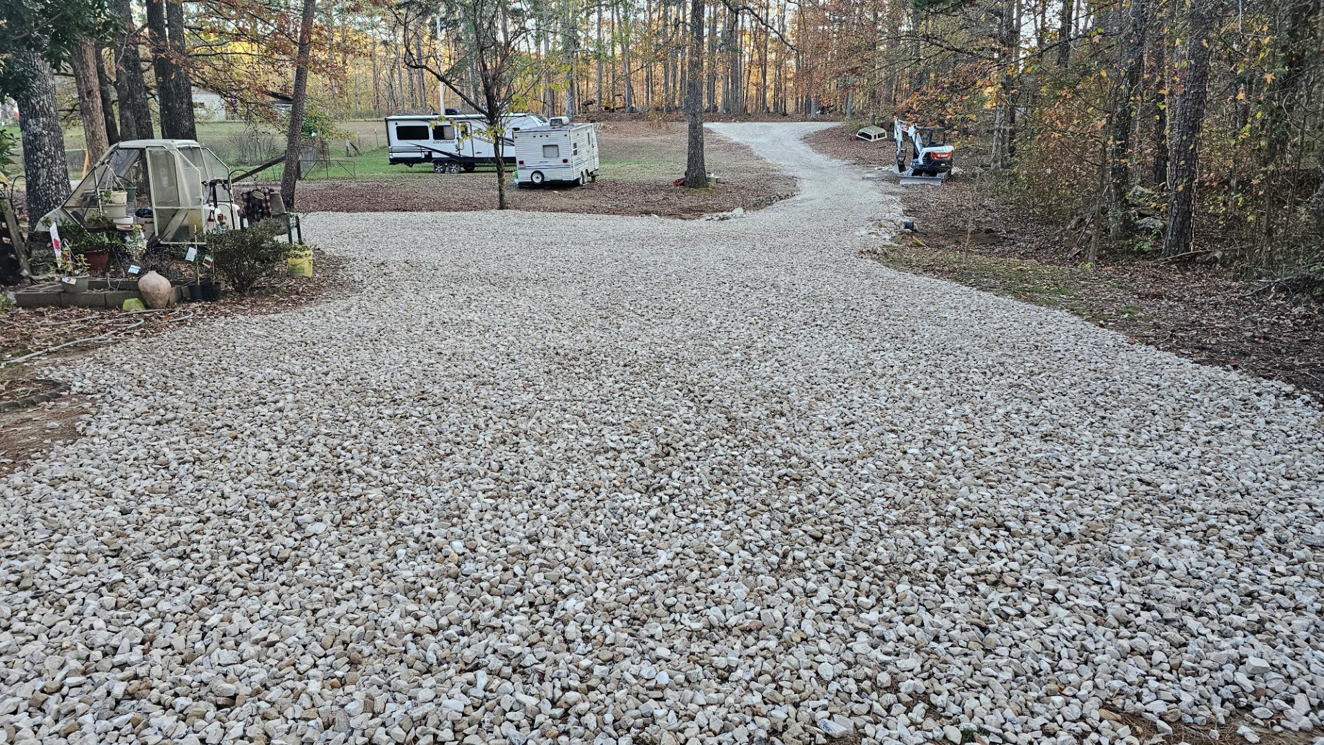 Finished gravel driveway through the trees