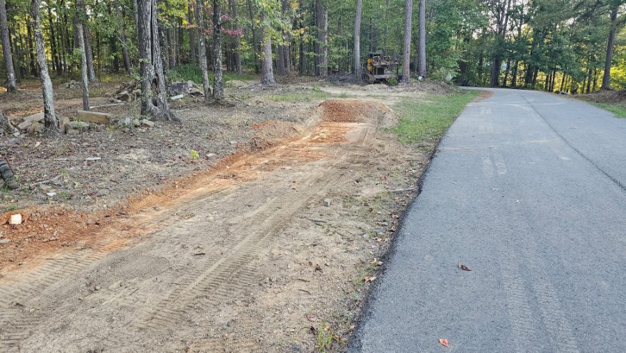 Dozer cutting a new driveway entrance
