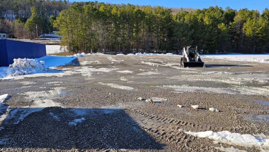 Gravel lot plowed clear of snow by Kingdom Land Services