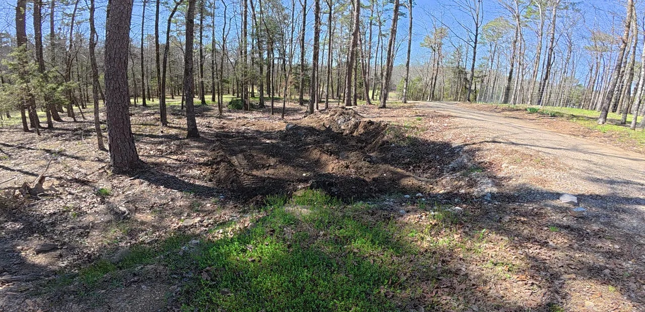 New culvert covered and the ground shaped over it